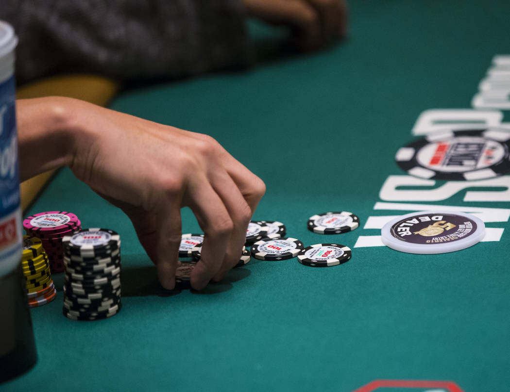 Las Vegas resident and "Jeopardy!" sensation James Holzhauer gathers chips after winn ...