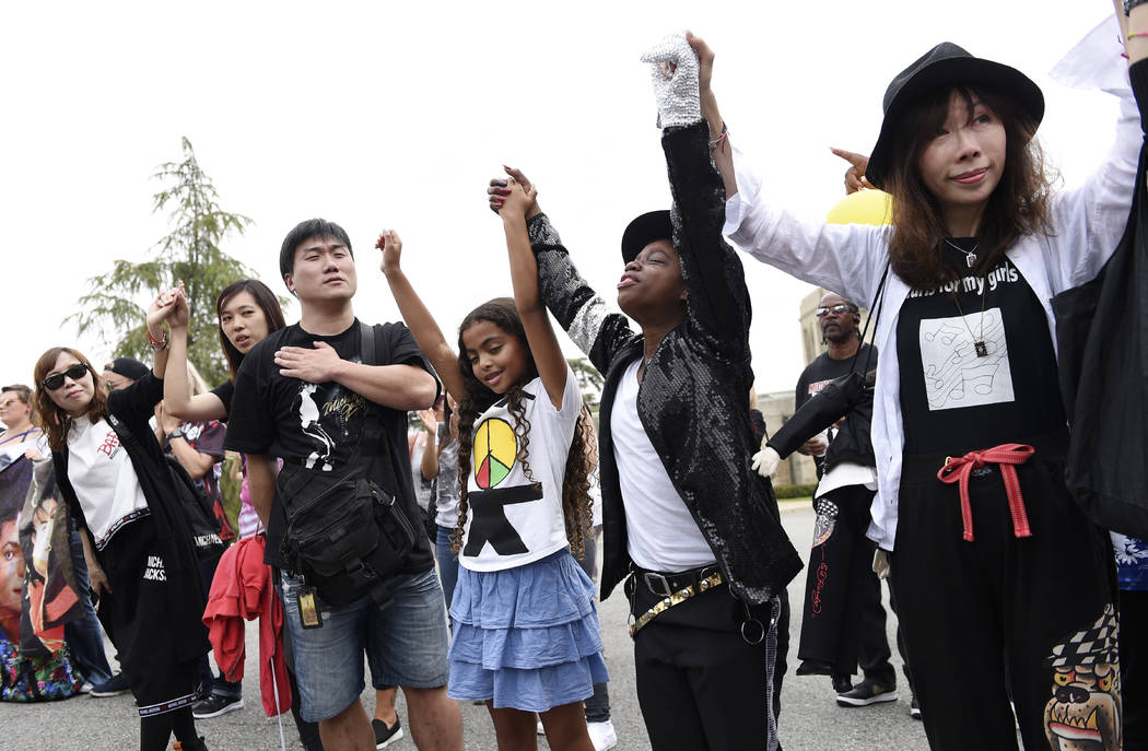 Michael Jackson fans gather outside the late pop star's final resting place at Forest Lawn Ceme ...