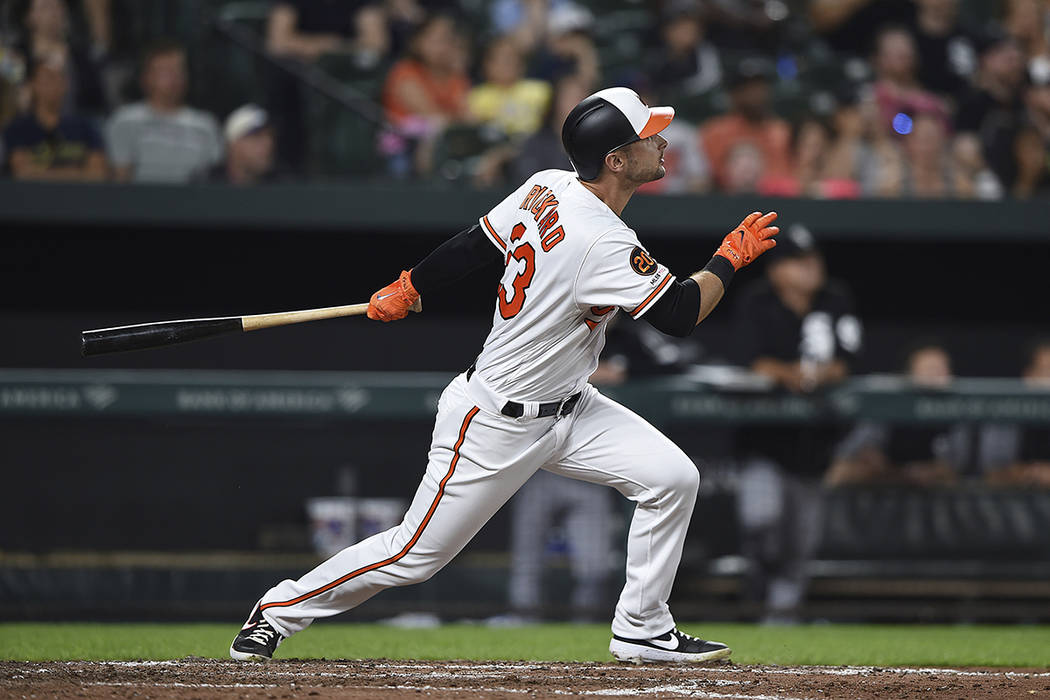 Baltimore Orioles' Joey Rickard follows through on a two-run home run against the Chicago White ...