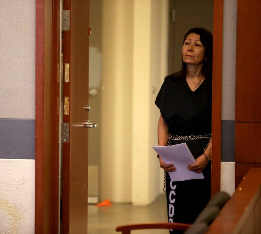 Retired Las Vegas police detective Pamela Bordeaux remains in a holding cell entrance outside t ...