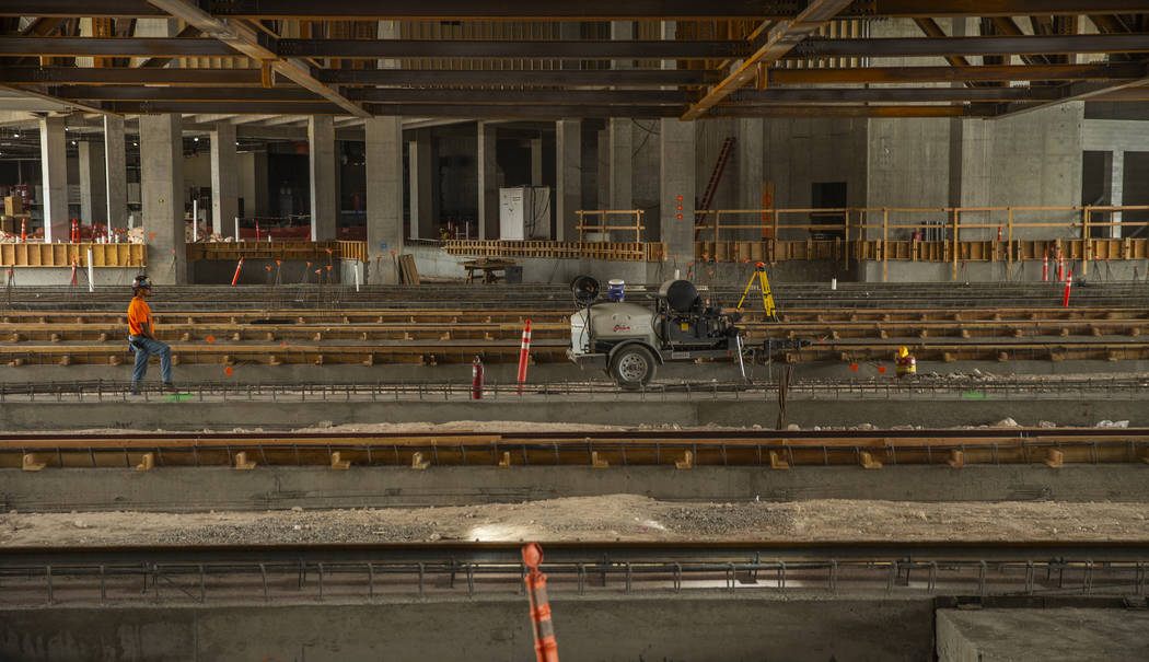 Tracks are being layed down which will be used to maneuver the grass field in and out of the Ra ...