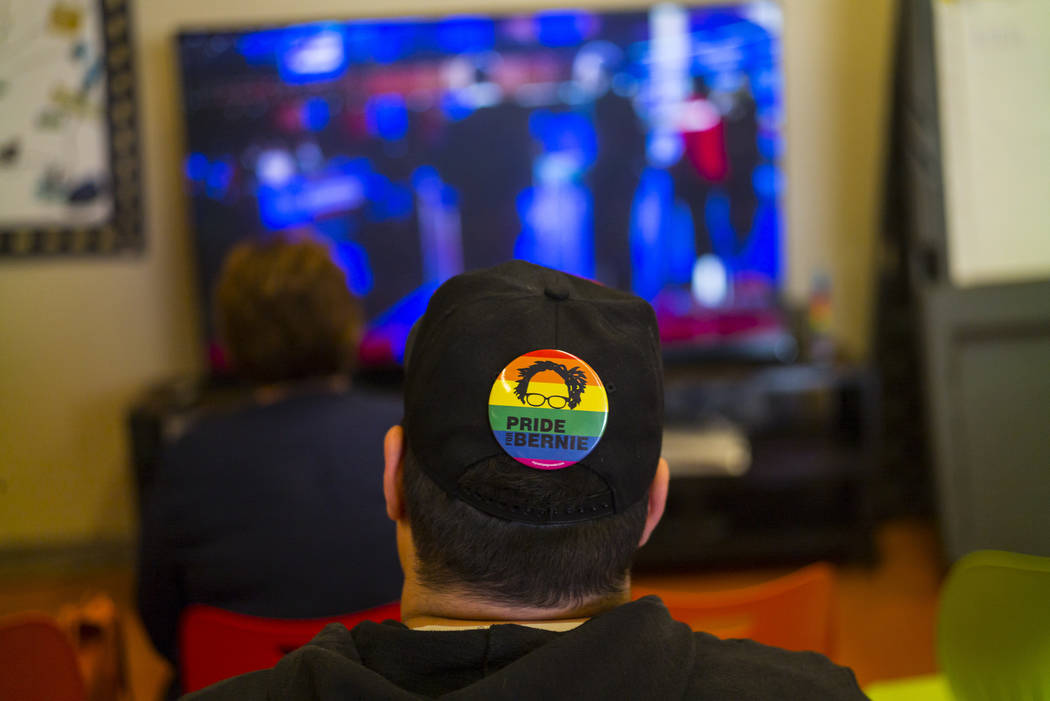 A Bernie Sanders supporter watches the Democratic presidential debate during a watch party held ...