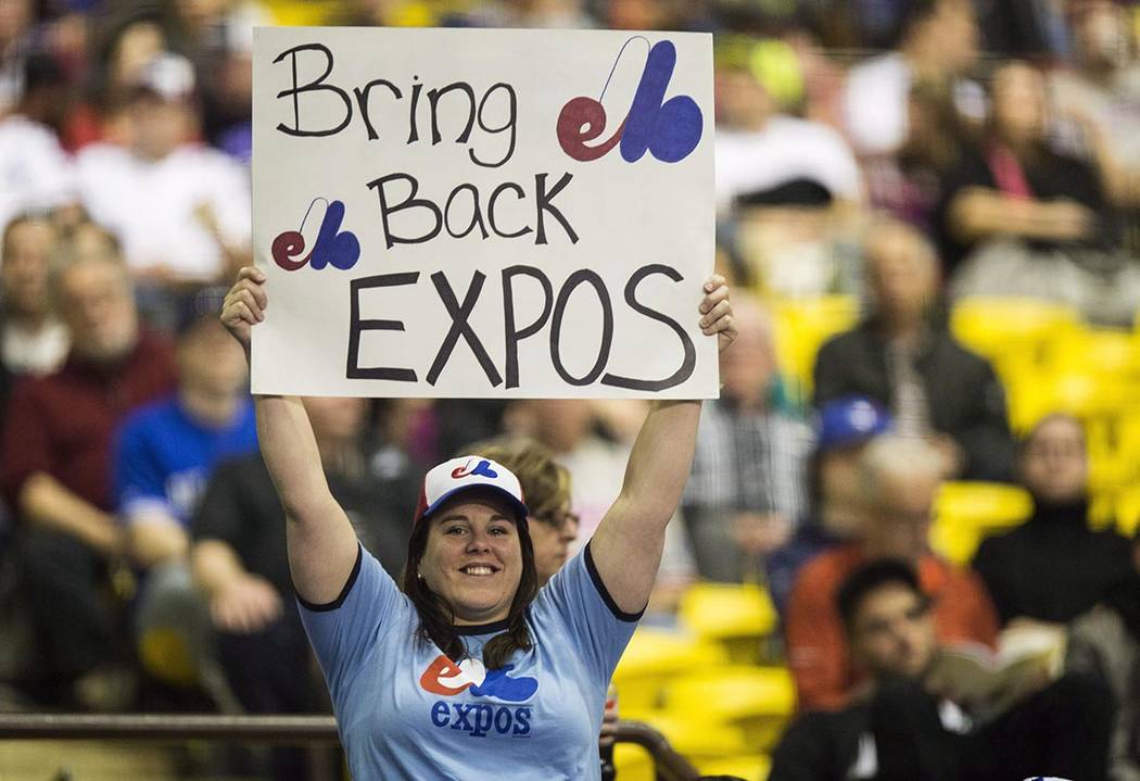 FILE - In this April 3, 2015, file photo, a fan holds up a sign during a pregame ceremony as th ...