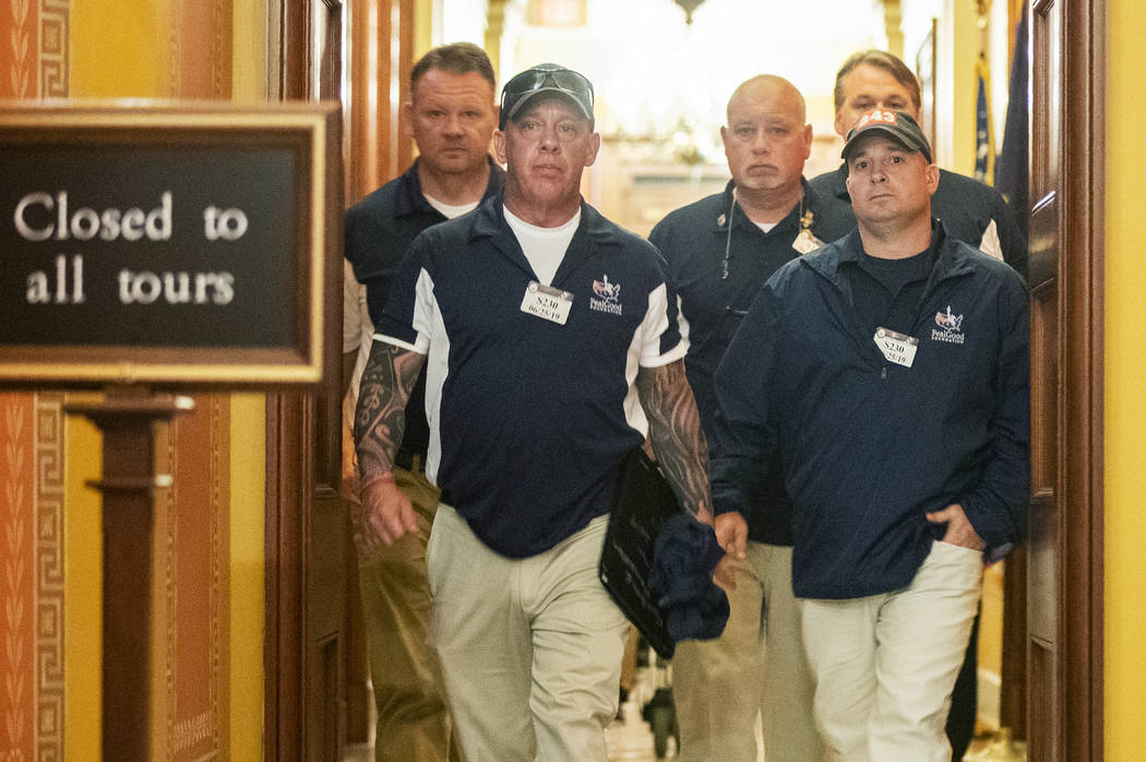 Sept. 11 first responders John Feal, front left, Ret. Lt. Michael O'Connell, front right, and o ...