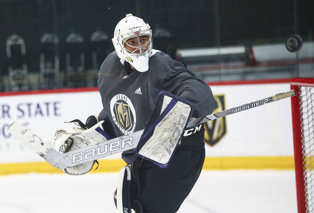 Golden Knights prospect Isaiah Saville defends the net during the first day of development camp ...