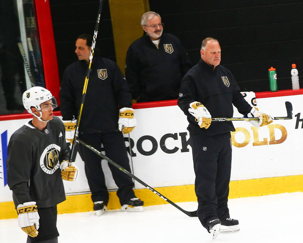 Golden Knights head coach Gerard Gallant, center left, watches prospects during the first day o ...