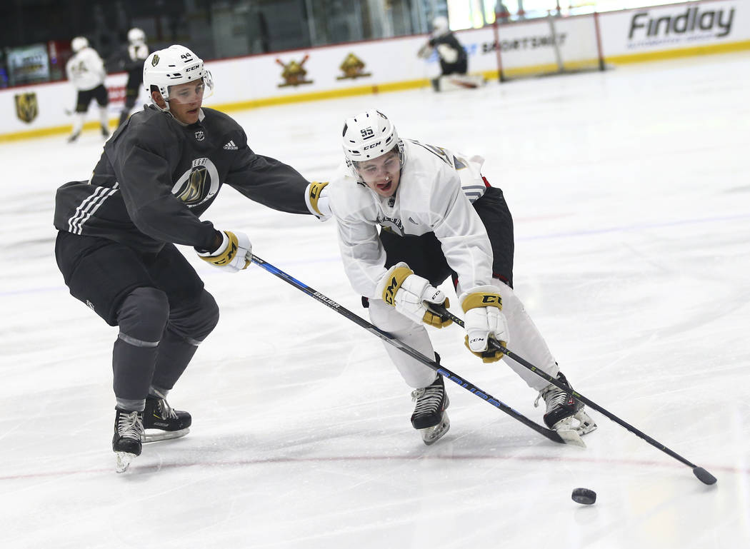 Golden Knights prospect Cullen McLean, right, skates around Layton Ahac during the first day of ...