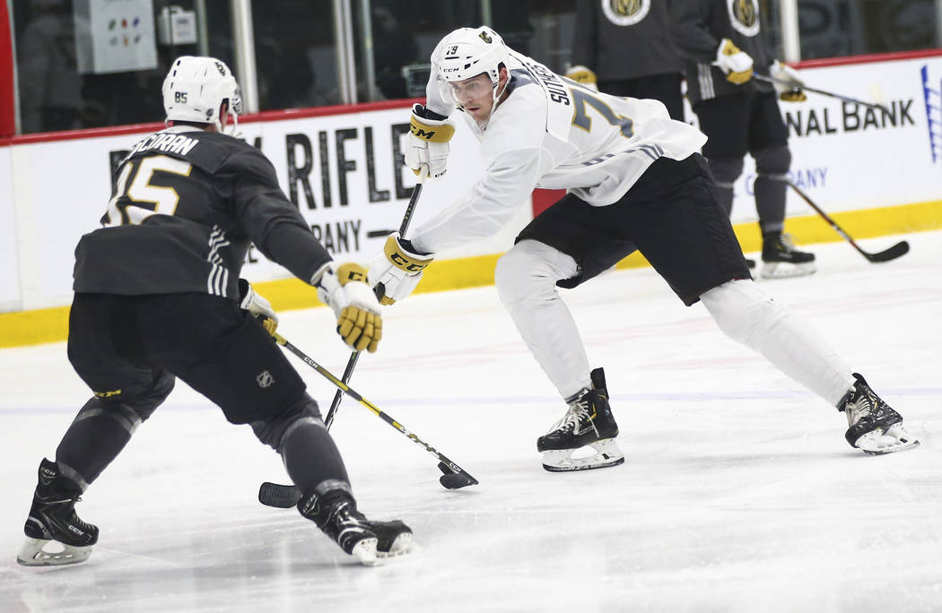 Golden Knights prospect Keenan Suthers skates with the puck against Connor Corcoran during the ...