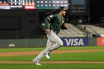 Oakland Athletics' Eric Campbell scores against the San Francisco Giants during the seventh inn ...