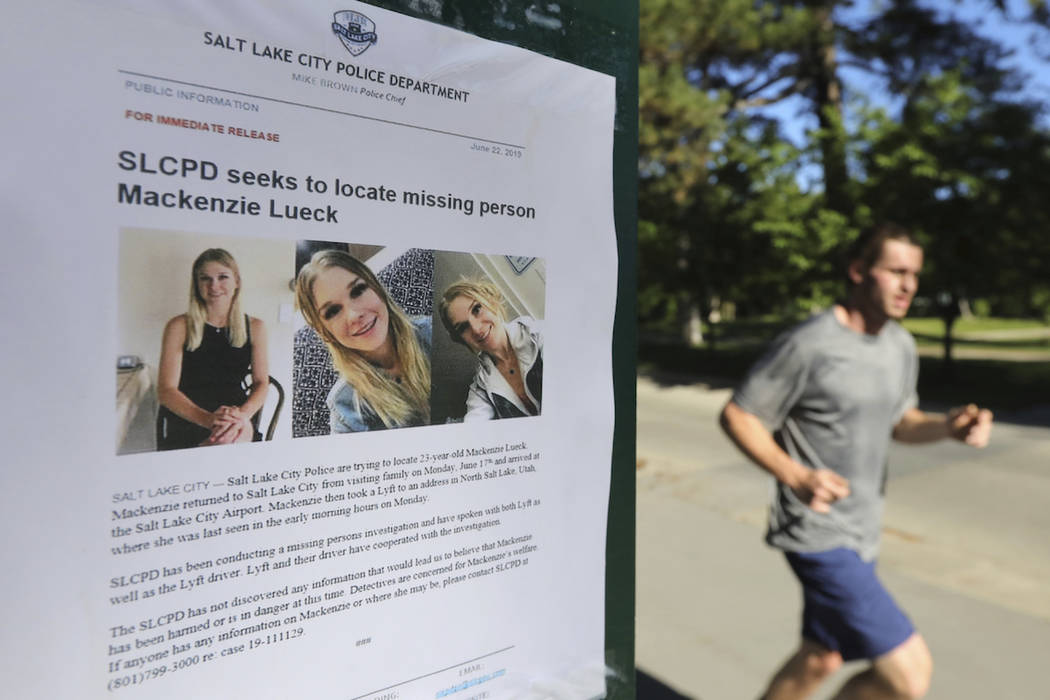 A joggers runs pass a poster of MacKenzie Lueck at Liberty Park Monday, June 24, 2019, in Salt ...