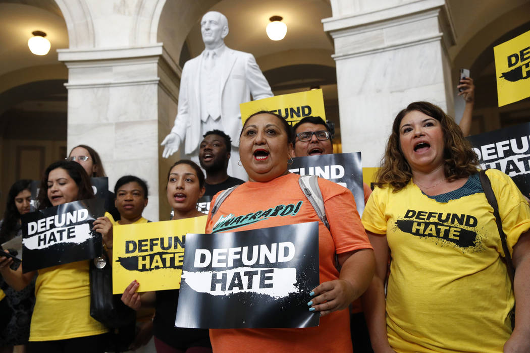 Protesters gather to demand the defunding of government agencies for border protection and cust ...