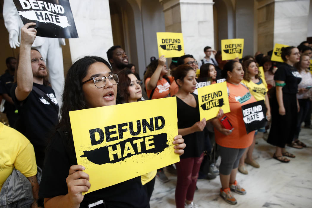 Protesters gather to demand the defunding of government agencies for border protection and cust ...