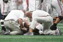 FILE - In this Dec. 1, 2018, file photo, Alabama quarterback Tua Tagovailoa (13) is helped by m ...