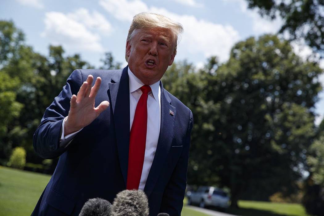 President Donald Trump talks with reporters before departing to Japan for the G20 summit, Wedne ...