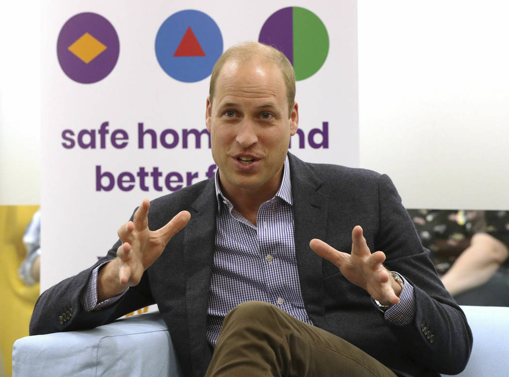 Britain's Prince William, the Duke of Cambridge, speaks to former and current service users dur ...