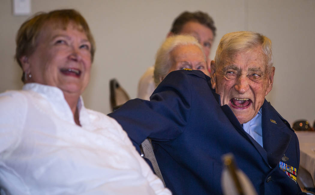 Susan Parker laughs with her father James "Jim" A. Parker while watching his life sto ...