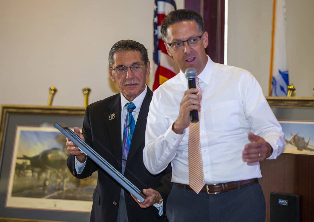 North Las Vegas city councilmen Richard Cherico, left, and Scott Black present a proclamation a ...