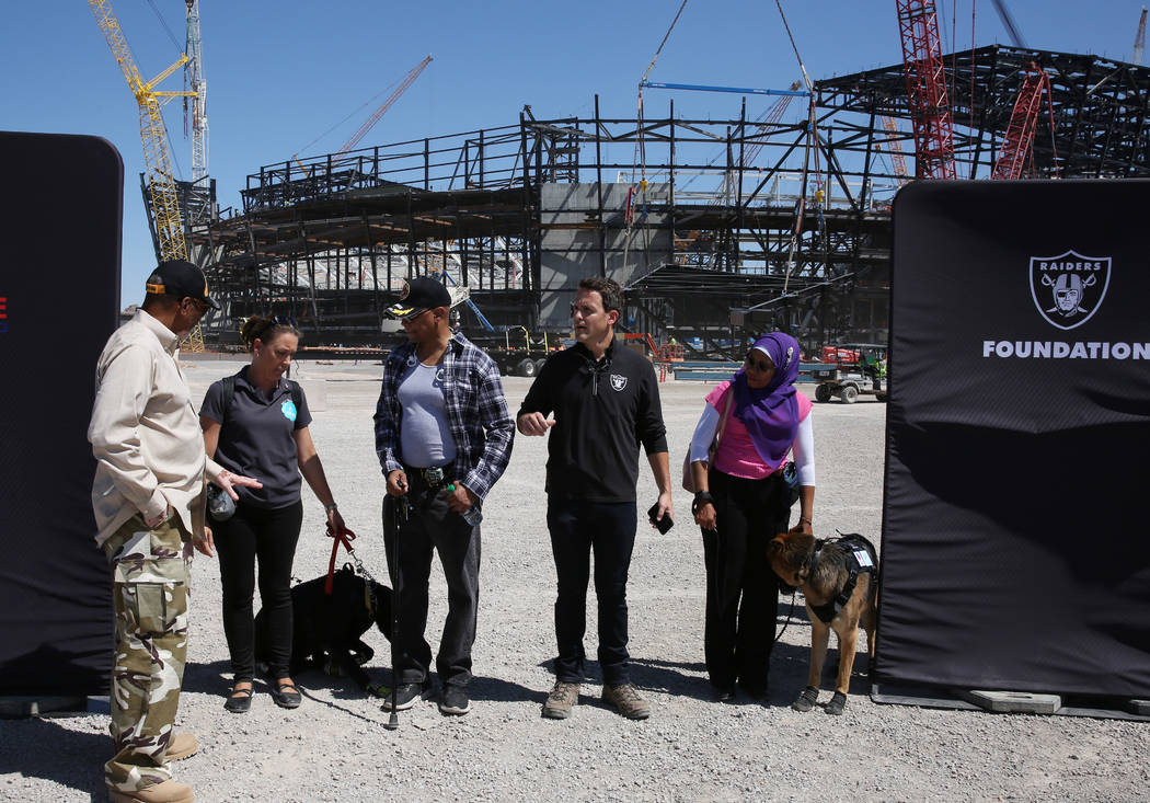 U.S. Army veteran Kenneth Brooks, left, Stephenie Gerken, Michael’s Angel Paws executive dire ...