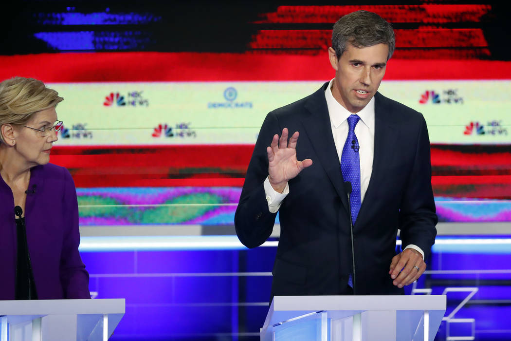 Democratic presidential candidate former Texas Rep. Beto O'Rourke answers a questions as Sen. E ...