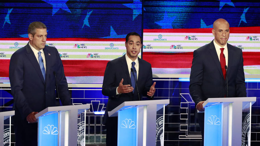 Democratic presidential candidate former Housing Secretary Julian Castro, center, speaks at the ...