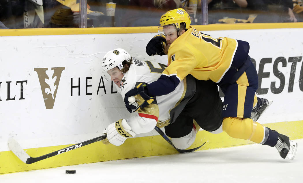 Nashville Predators defenseman Ryan Ellis (4) brings down Vegas Golden Knights center Erik Haul ...