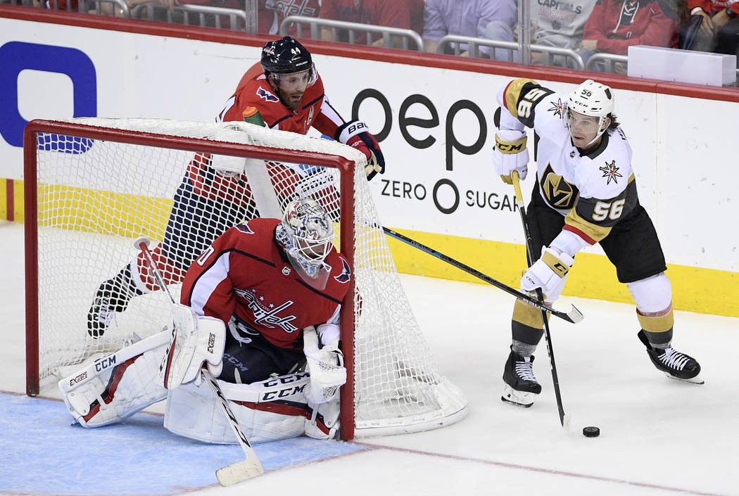 Vegas Golden Knights left wing Erik Haula (56) skates with the puck next to Washington Capitals ...