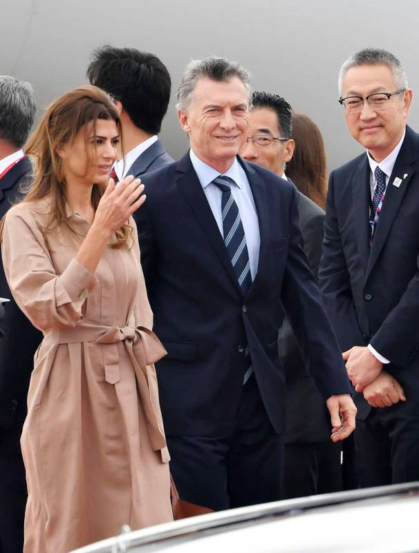 Argentina's President Mauricio Macri, center right, and his wife first lady Juliana Awada arriv ...