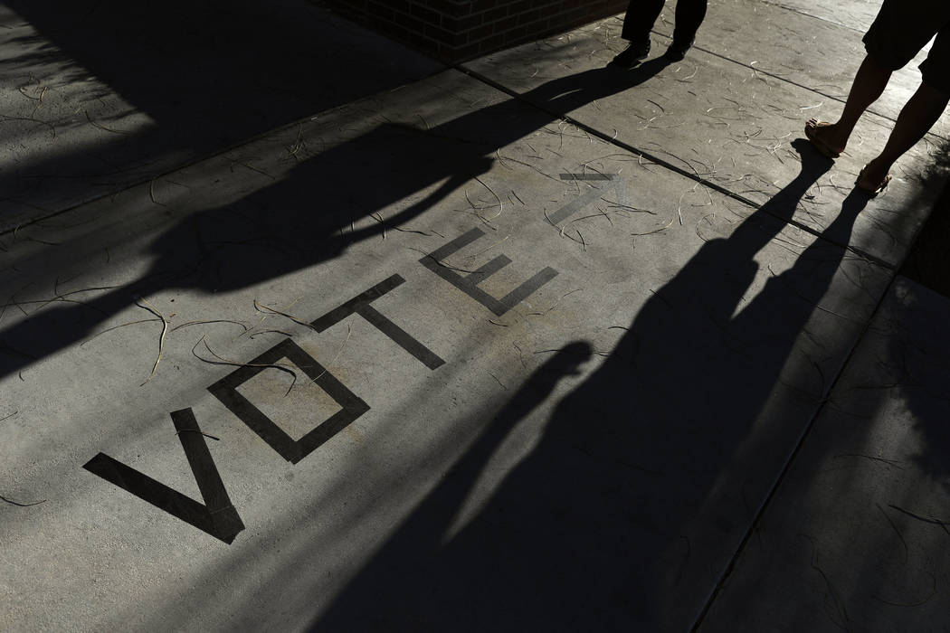 In a Nov. 6, 2018, file photo, voters head to the polls at the Enterprise Library, in Las Vega ...