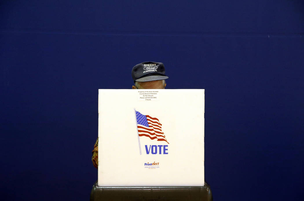 In a Nov. 6, 2018, file photo, a voter fills out a ballot at a polling place at Lake Shore Elem ...