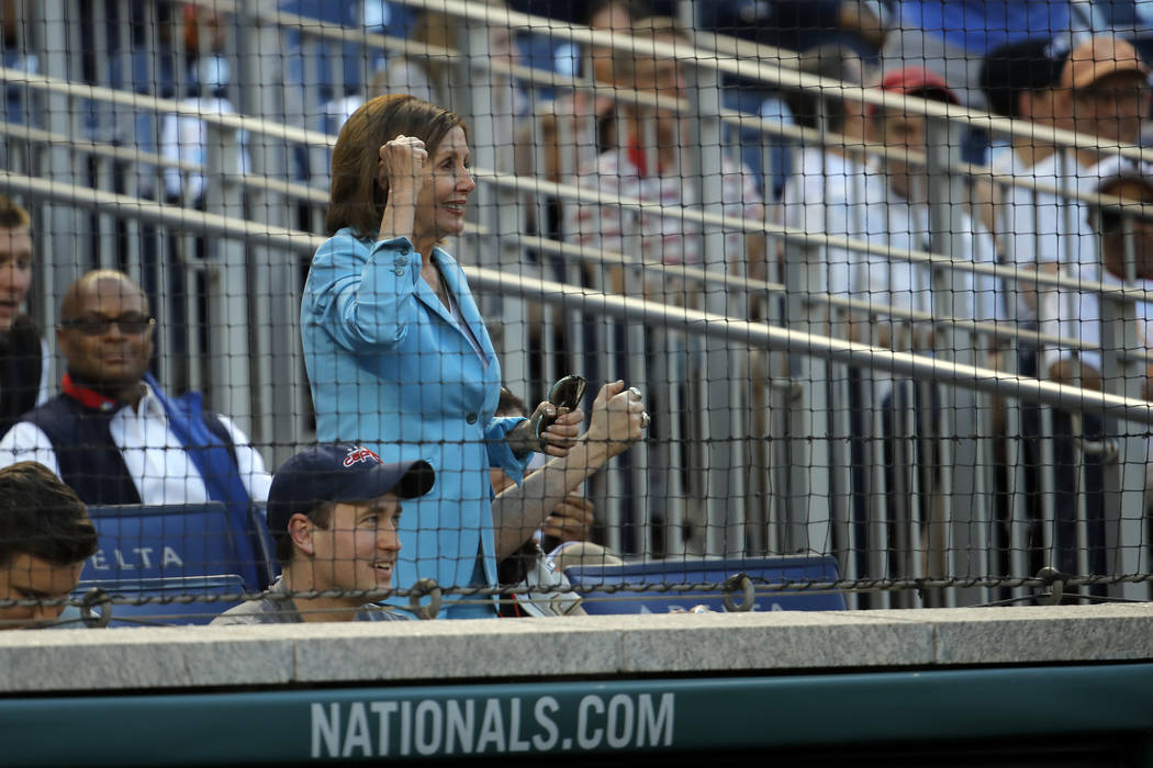 House Speaker Nancy Pelosi of Calif., cheers during the Congressional Baseball Game at National ...