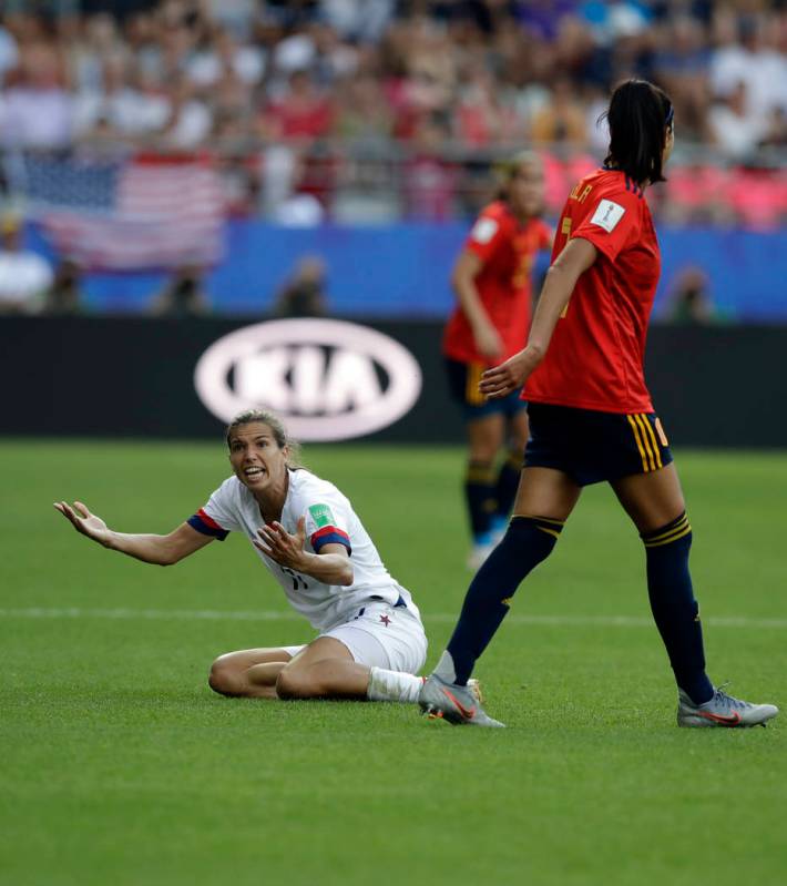 United States' Tobin Heath, left, reacts after a foul by Spain's Leila Ouahabi during the Women ...