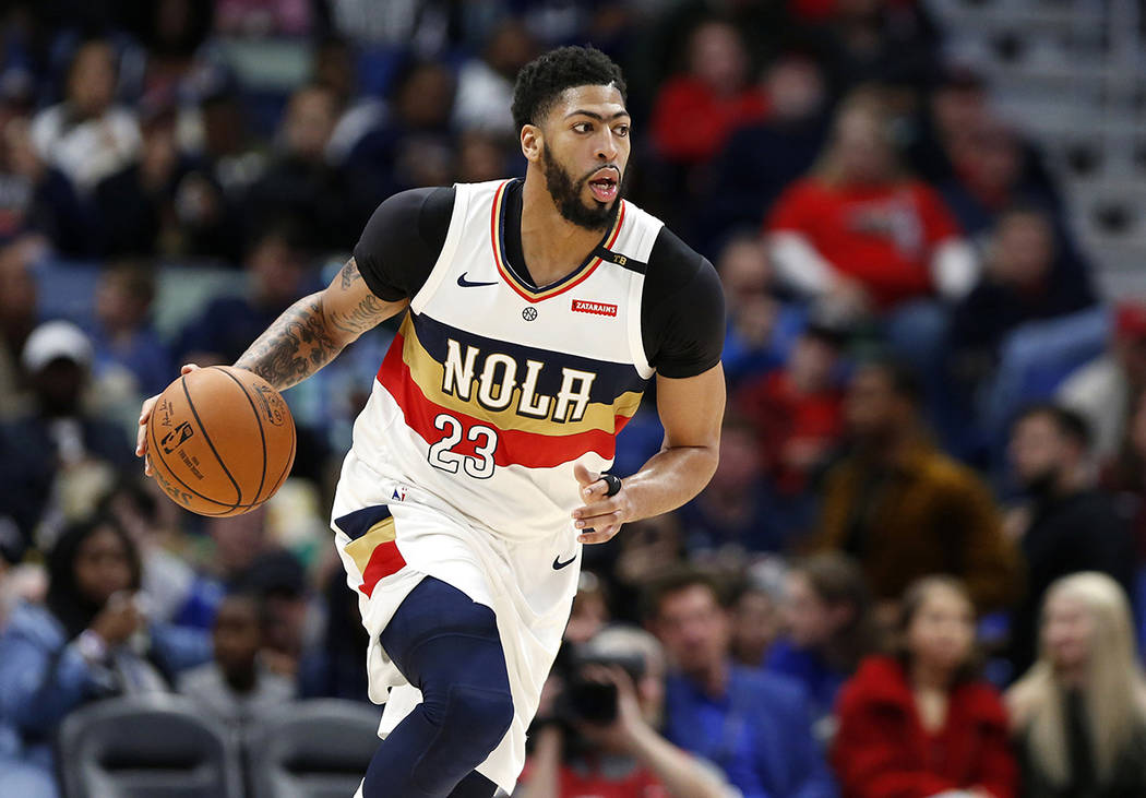 In this March 16, 2019, file photo, New Orleans Pelicans forward Anthony Davis brings the ball ...