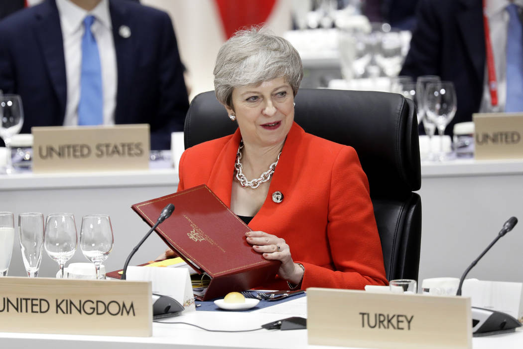 Britain's Prime Minister Theresa May attends a working lunch at the Group of 20 (G-20) summit i ...