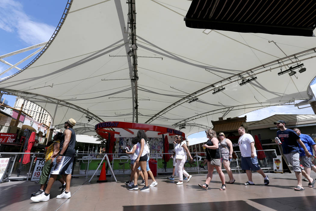 People walk on the Strip through the Hawaiian Marketplace Tuesday, May 22, 2018. A 16-acre piec ...