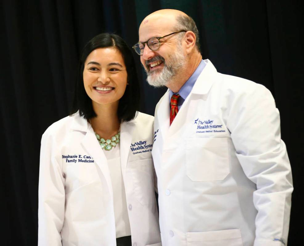 Family medicine resident Stephanie Cao, left, poses with Tom Hunt, family medicine program dire ...