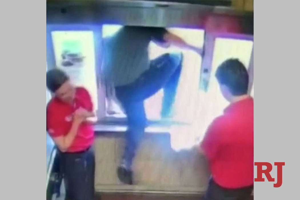 Chick-fil-A employee Logan Simmons climbs through a drive-thru window to to save a choking boy ...