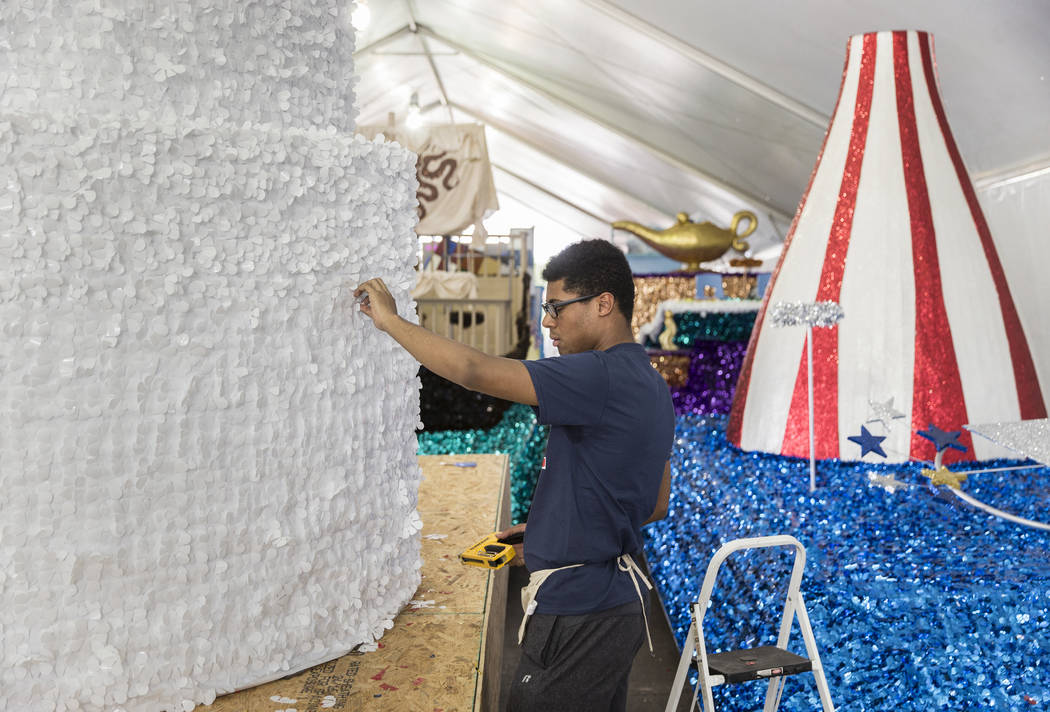 Dwight Jones works on a float during preparation for the Summerlin Patriotic Parade on Saturday ...