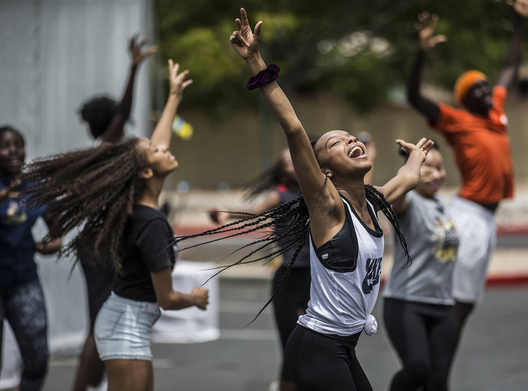 Jazmun McCoy, right, dances with members of the West Las Vegas Arts Center Performance Ensemble ...