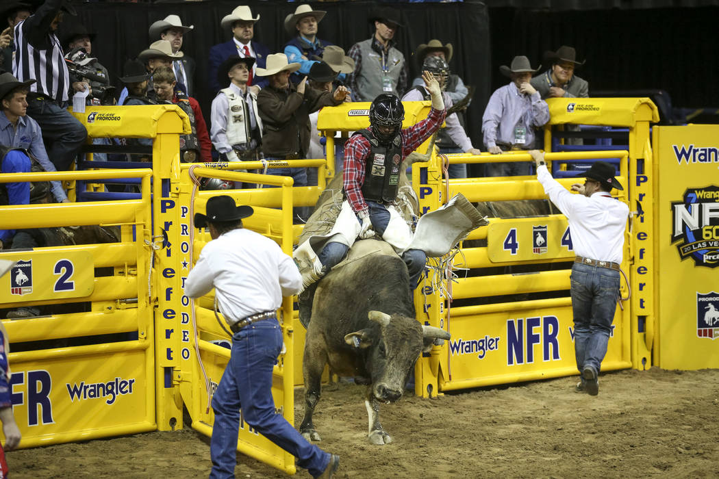 Eli Vastbinder of Union Grove, N.C. (105) competes in the bull riding event during the ninth go ...