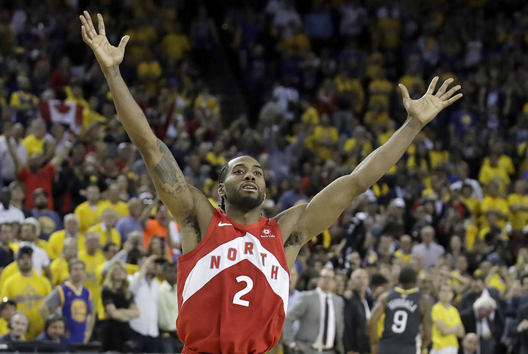 Toronto Raptors forward Kawhi Leonard celebrates after the Raptors defeated the Golden State Wa ...