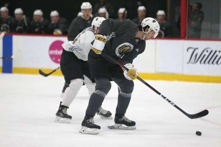 Vegas Golden Knights' Nicolas Hague moves the puck during a development camp scrimmage at City ...
