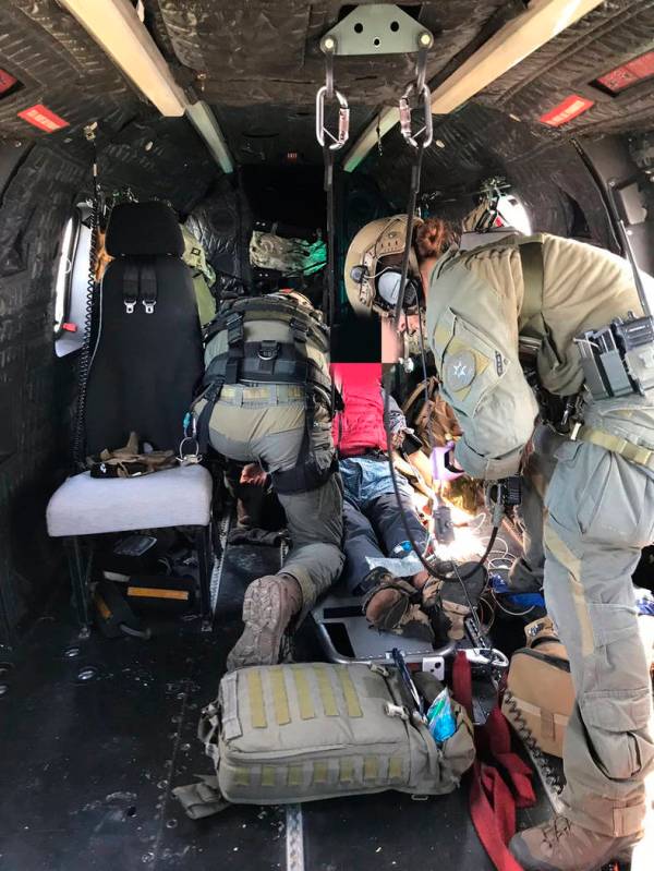 This image shows 73-year-old Eugene Jo being airlifted on Air Rescue 5, by SEB Tactical Medics ...