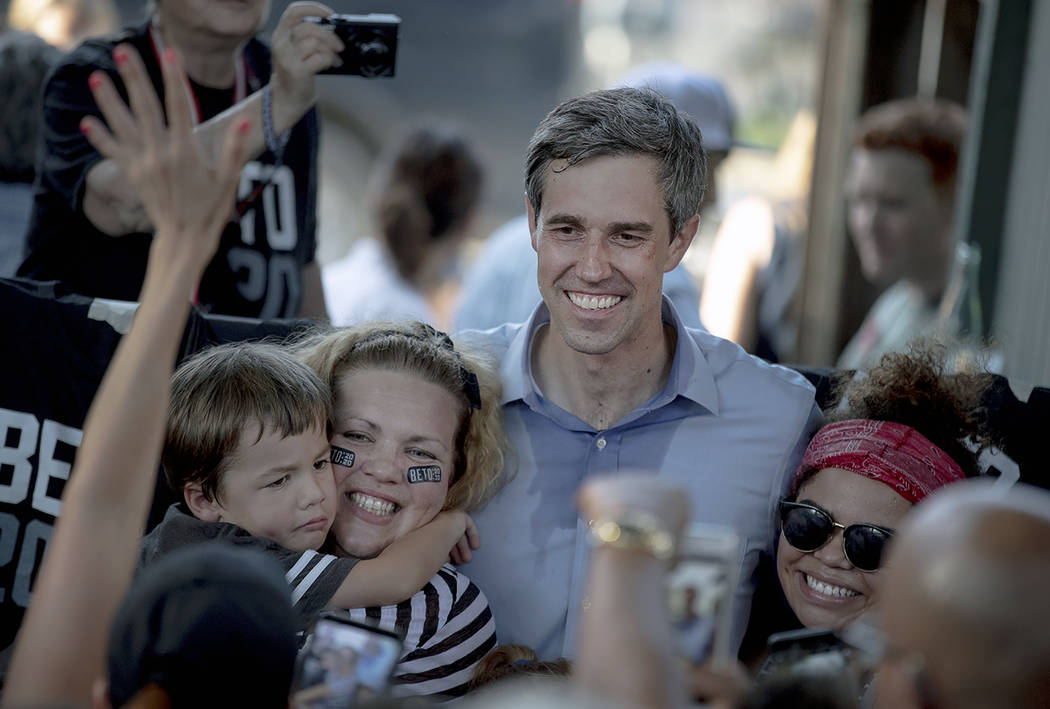 Democratic presidential candidate Beto O'Rourke poses for a photo with supporters following a c ...