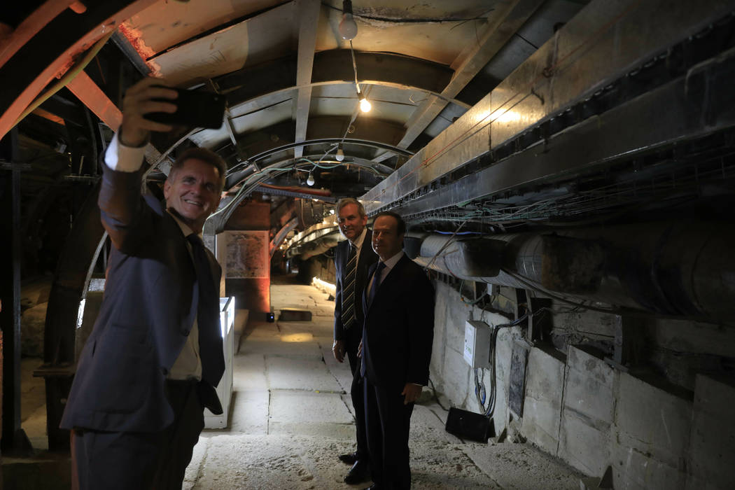 People take selfies inside an ancient tunnel during the opening of an ancient road at the City ...