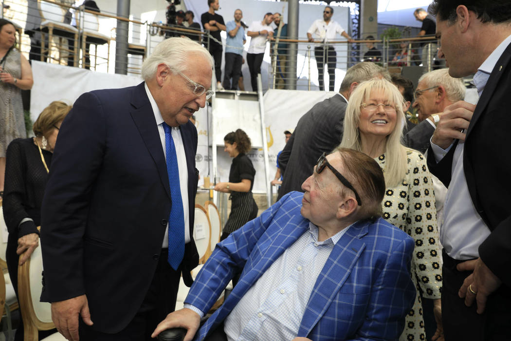 U.S. Ambassador to Israel David Friedman, left, talks to American business magnate Sheldon Adel ...