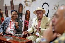 Ron Arellano, from left, Garo Bouldoukian, and Charlie Guluzian smoke cigars together at the Ga ...