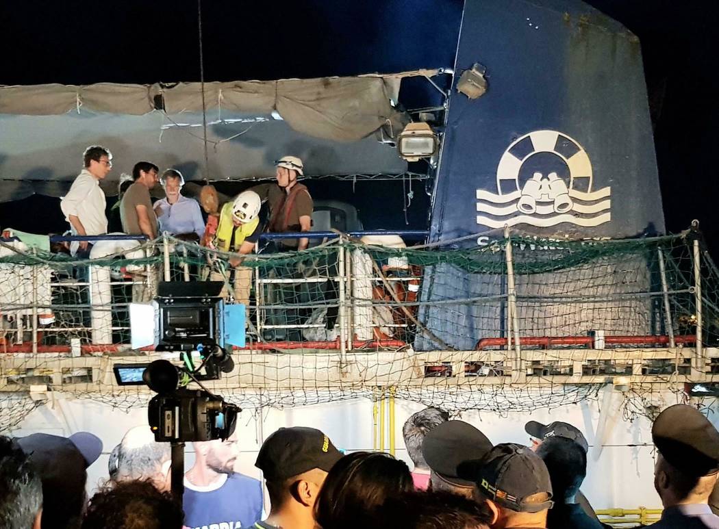 The Dutch-flagged Sea Watch 3 ship docks at Lampedusa island's harbor, Italy, early Saturday, J ...