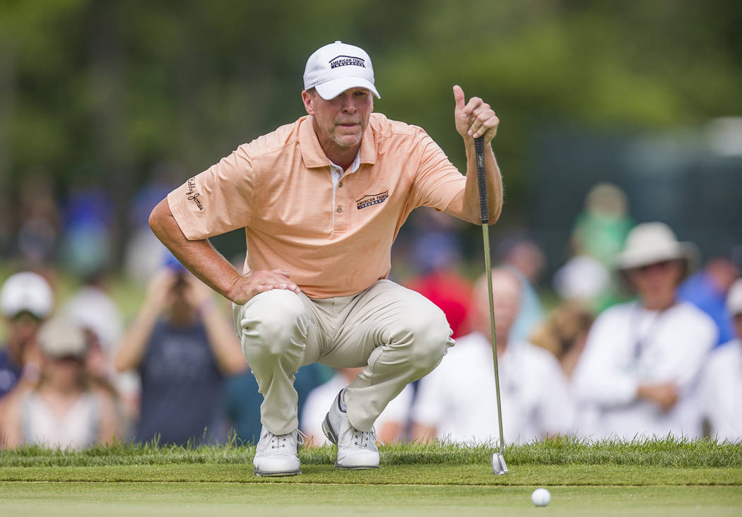 Steve Stricker lines up a putt on the fifth hole during the final round of the U.S. Senior Open ...