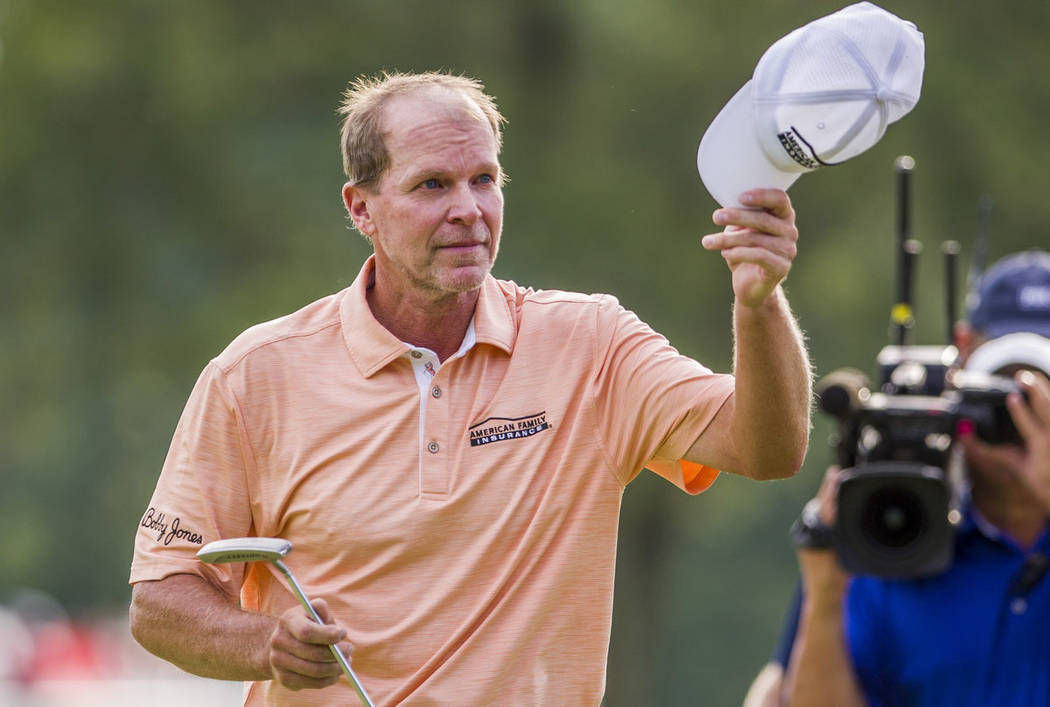 Steve Stricker tips his hat to fans after winning the U.S. Senior Open following the final roun ...