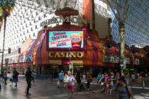 People walk by the Fremont Casino in Las Vegas, Wednesday, June 12, 2019. (Michael Blackshire/L ...